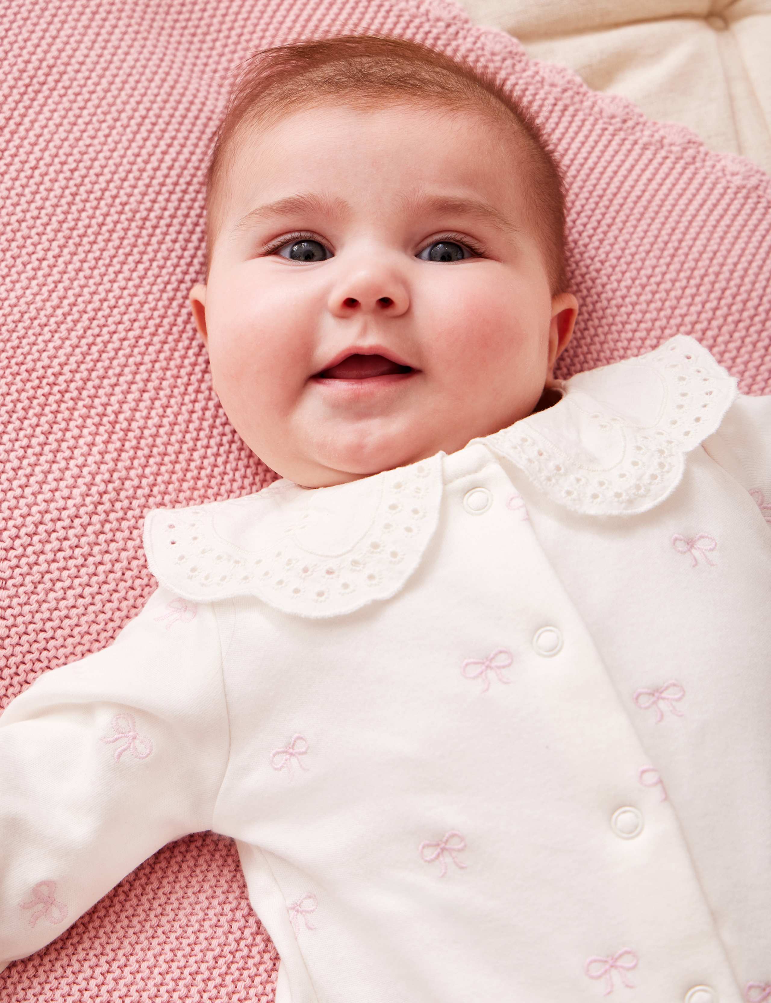 Pure Cotton Bow Sleepsuit (7lbs-18 Mths) 2 of 3