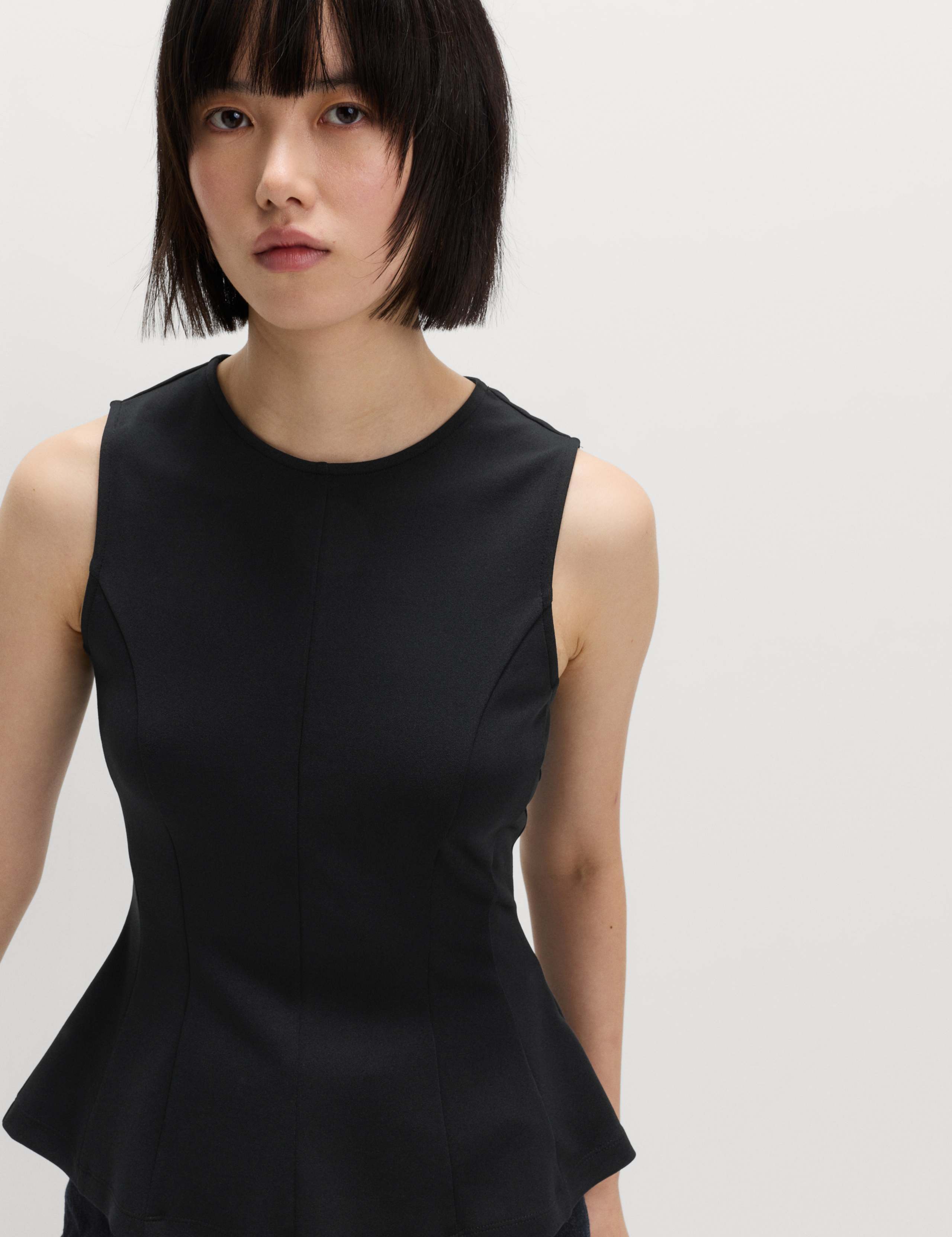 Fitted Sleeveless Peplum Top 1 of 8