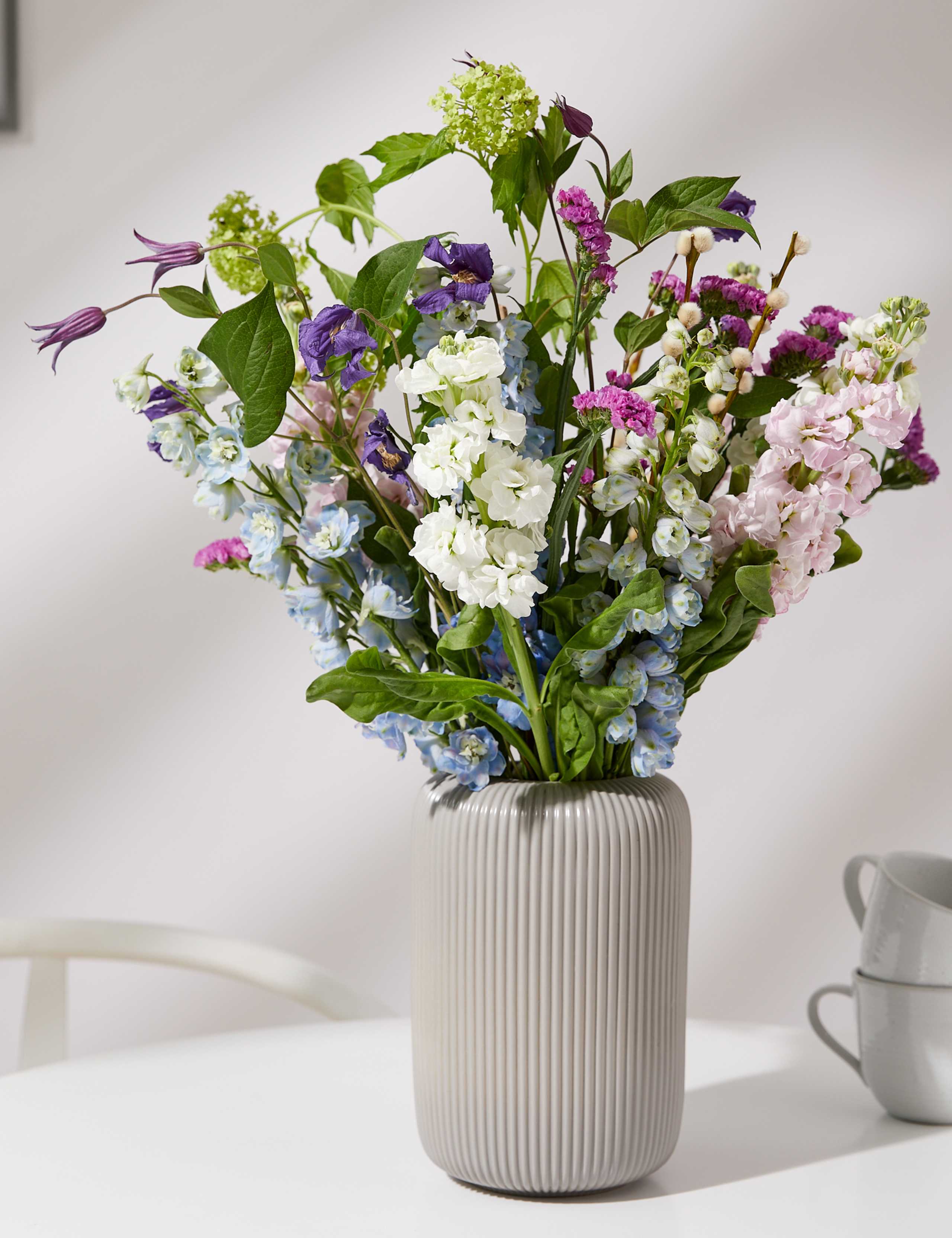 Stock, Delphinium & Clematis Bouquet with Vase (Available until 02/03/24) 1 of 6