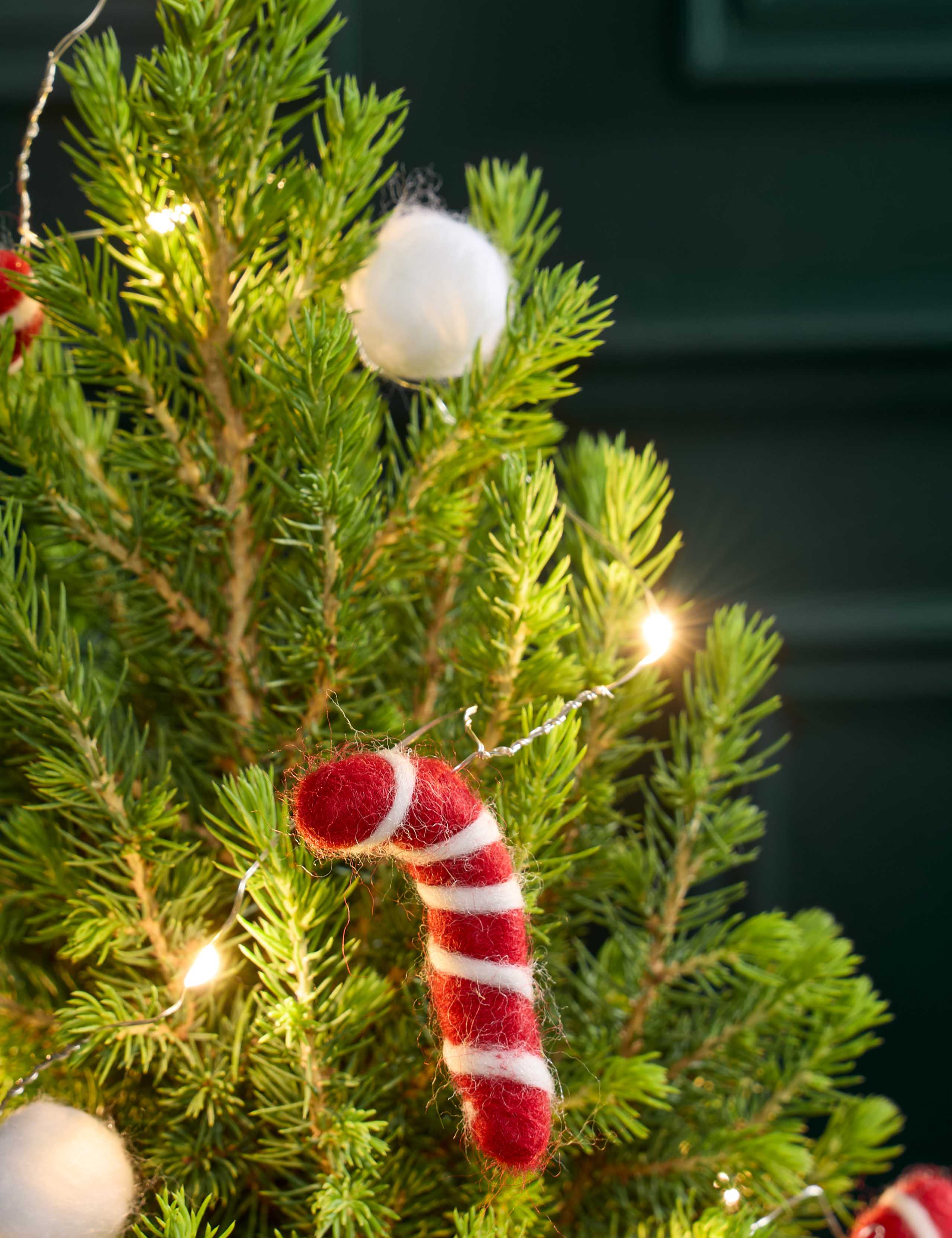 White Decorated Christmas Tree with Merry Munch Tin 2 of 3